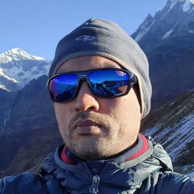 Marut Dhungana on a Himalayan trek, with Machhapuchhre in the background